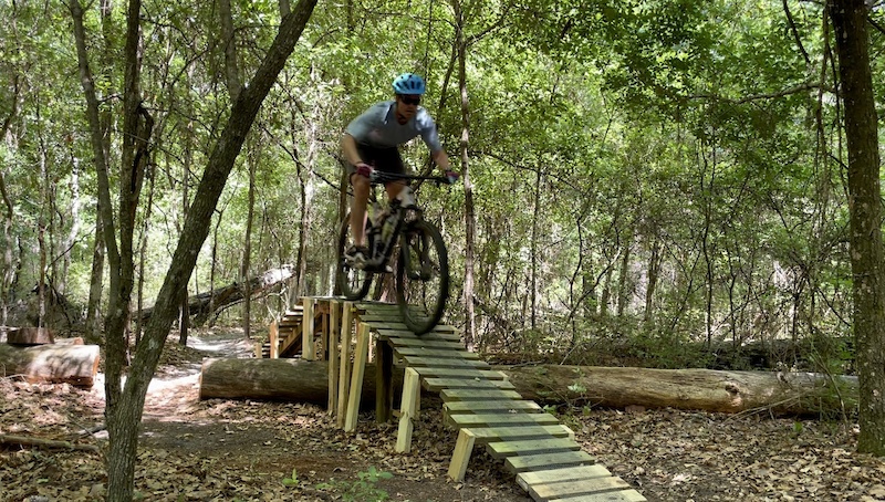 Man on wooded trail